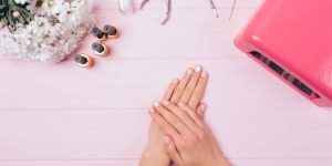 Woman receives a gel manicure