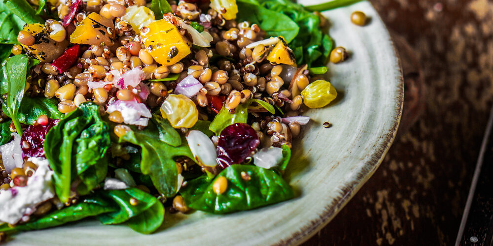 Healthy salad with farro, spinach and lentils